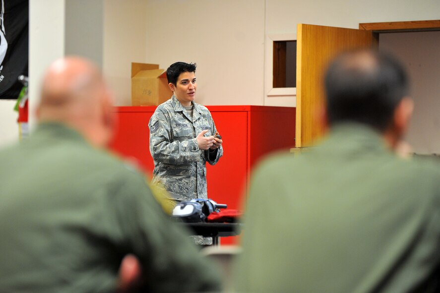 U.S. Air Force Tech. Sgt. Whitney Rhoads, 55th Operations Support Squadron NCO in-charge of aircrew flight equipment, briefs members of the U.K. Royal Air Force as part of RC-135 Rivet Joint upgrade training April 15 at the Bennie Davis Maintenance Facility, Offutt Air Force Base, Neb.  In 2010, the Department of Defense and the U.K. Ministry of Defense came up with an agreement for the RAF to purchase three RJs. (U.S. Air Force Photo by Josh Plueger/Released)