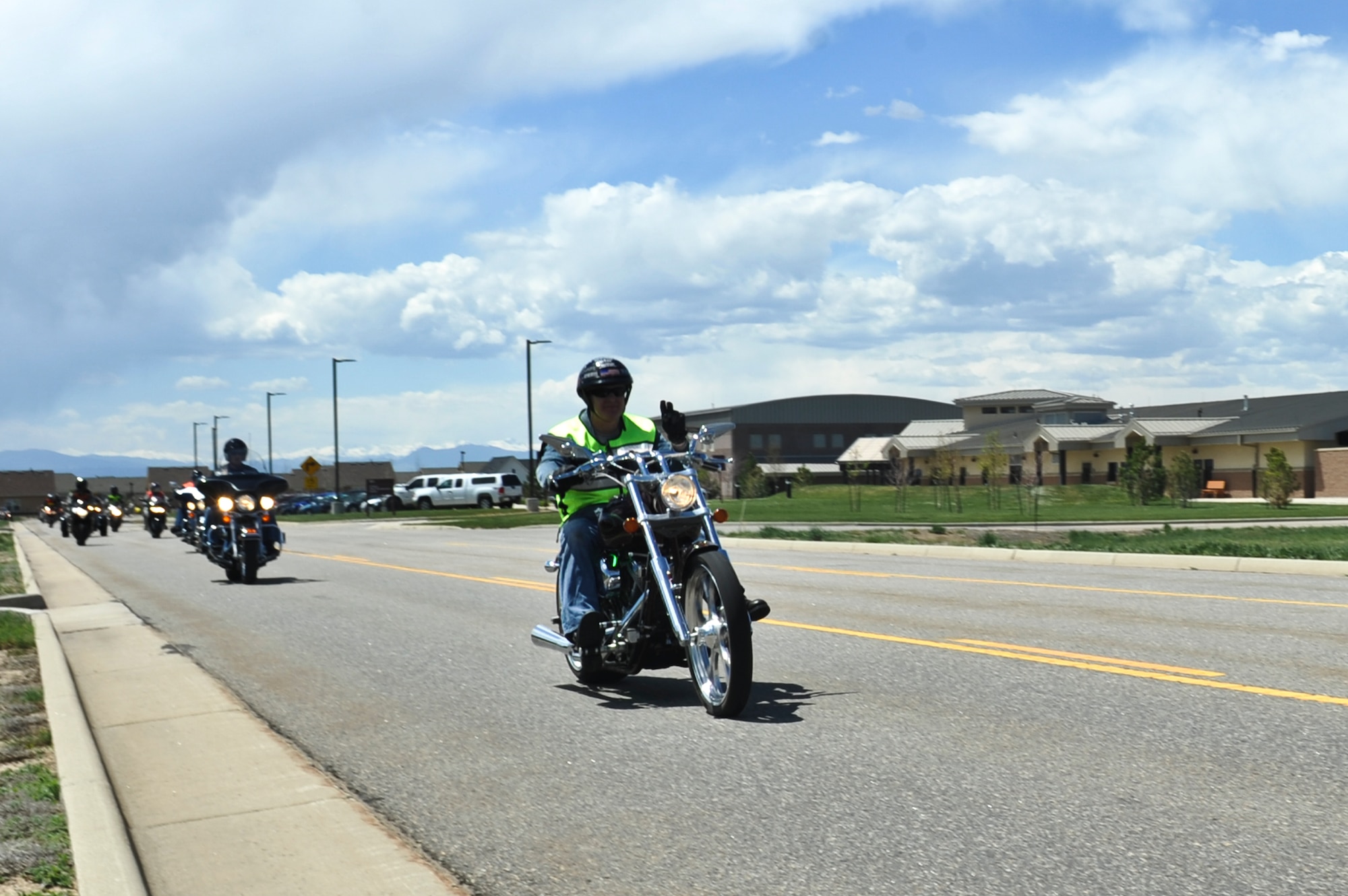 Col. Dan Dant, 460th Space Wing commander, drives his motorcycle May 16, 2013, Buckley Air Force Base, Colo.  More than 40 Team Buckley members participated in the farewell motorcycle ride hosted for Dant. The farewell ride started with a required pre-season motorcycle safety brief presented by the 460th Space Wing Safety Office and a burger burn by the Air Force Sergeants Association.  (U.S. Air Force photo by Airman 1st Class Riley Johnson/Released)