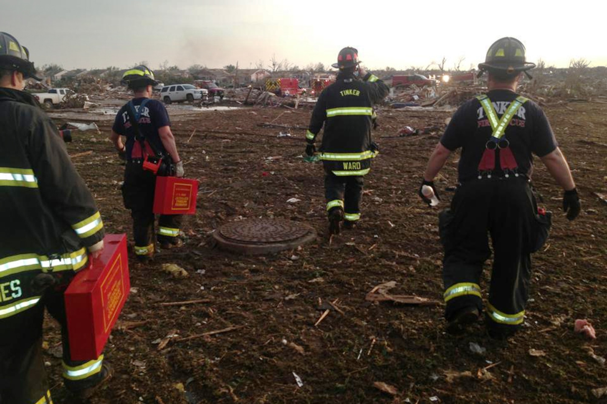 A Tinker Fire and Emergency Services crew responds to the May 20 tornado that struck Moore, Okla. Twelve base firefighters and one safety officer were immediately dispatched to assist with rescue activities in the vicinity of 19th street and Interstate 35 in Moore, and one surgeon was dispatched to OU Medical Center. More help has been provided overnight with lights, vehicles, water trucks and volunteer Airmen are preparing to assist with crowd control and recovery efforts. (Photo courtesy of Tinker Fire and Emergency Services)
