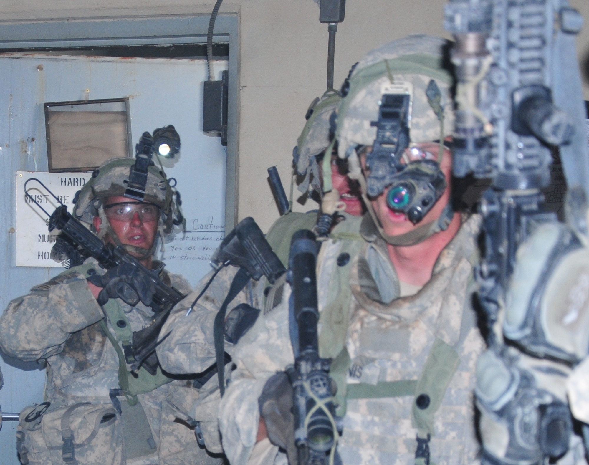 Soldiers from 1st Battalion, 6th Infantry Regiment, 2nd Brigade Combat Team, 1st Armored Division, conduct a mock raid inside a tunnel at the Network Integration Evaluation 13.2, at White Sands Missile Range, N.M. (U.S. Army photo by Lt. Col. Deanna Bague/Released).

