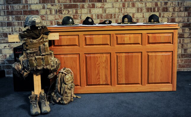 Law enforcement hats line the table to show the different units of law enforcement officers in the local area at Moody Air Force Base, Ga., May 15, 2013. The 15th of May has been declared the National Police Remembrance Day in remembrance of the sacrifices police officers made to protect the community. (U.S. Air Force photo by Airman Alexis Grotz/ Released)