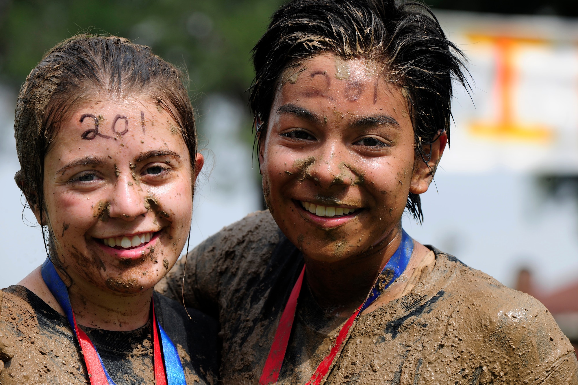 Members of Team Incirlik pose for a photo after completing the Ultimate Dirty Dash 3 in first place for the women's category May 18, 2013, at Incirlik Air Base, Turkey. Between mounds of mud, deep mud pits and mud filled tunnels, contestants were bound to get dirty during the event. (U.S. Air Force photo by Senior Airman Anthony Sanchelli/Released)

