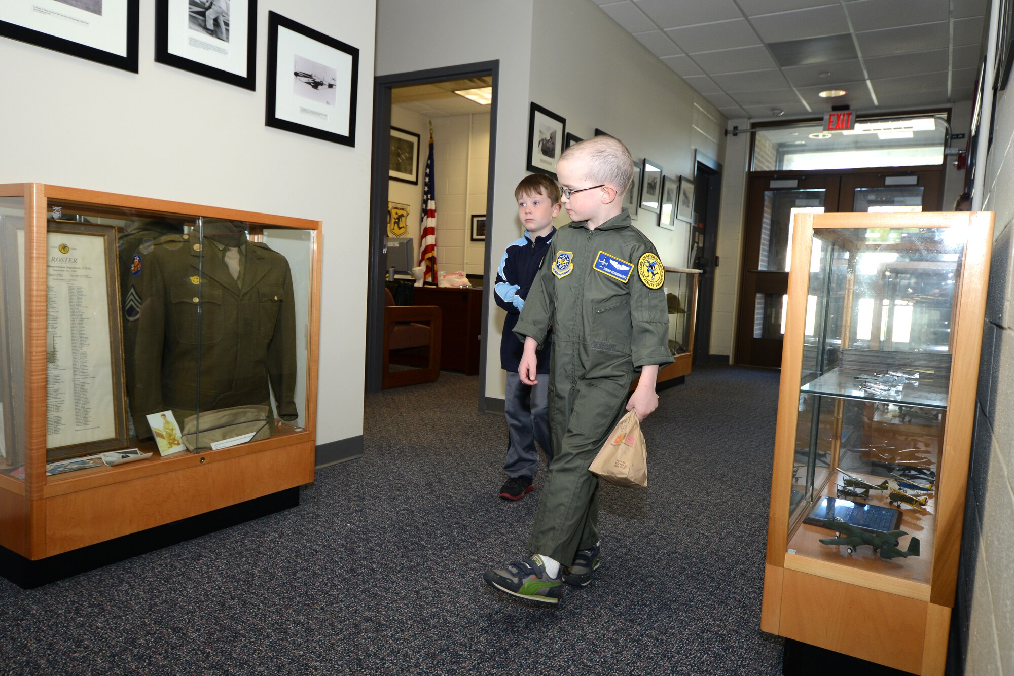 Logan Schoenhardt and his friend, Andrew Kerwin, take a tour in the operations building during the Pilot for A Day Program at Bradley Air National Guard Base, East Granby, Conn., May 3, 2013.  (Air National Guard photo by Tech. Sgt. Joshua Mead/Released)