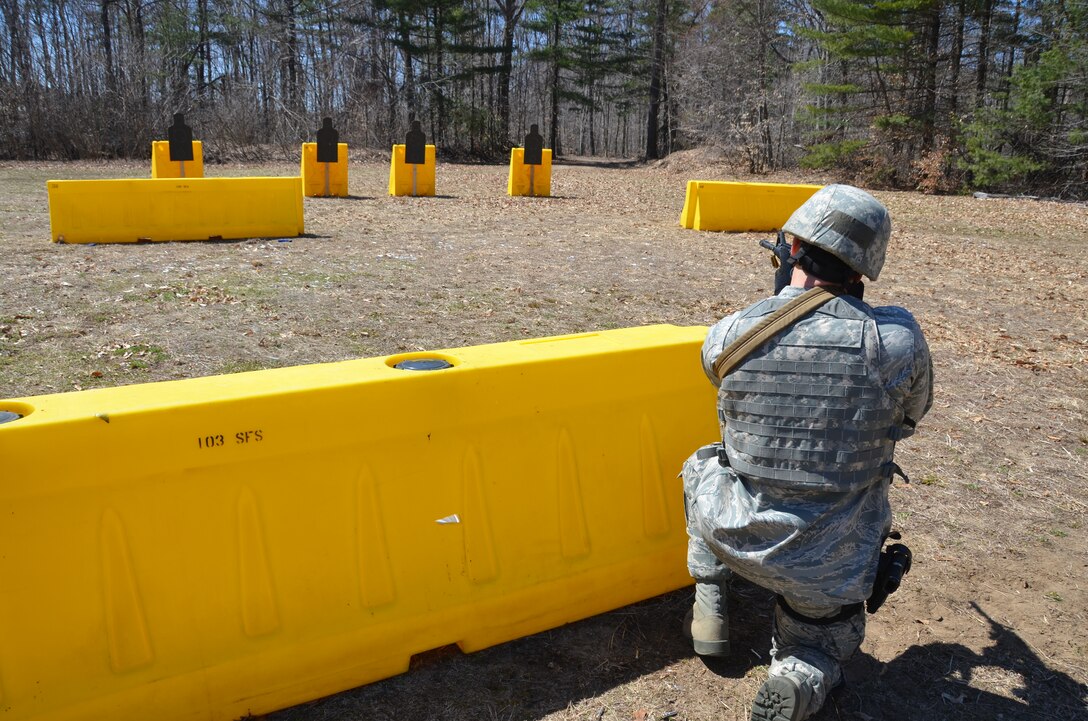 An Airman with the 103rd Security Forces Squadron takes aim on a target downrange during a shoot, move and communicate training session at Bradley Air National Guard Base, East Granby, Conn., April 6, 2013. (Air National Guard photo by 1st Lt. Dawn Surprenant/Released)