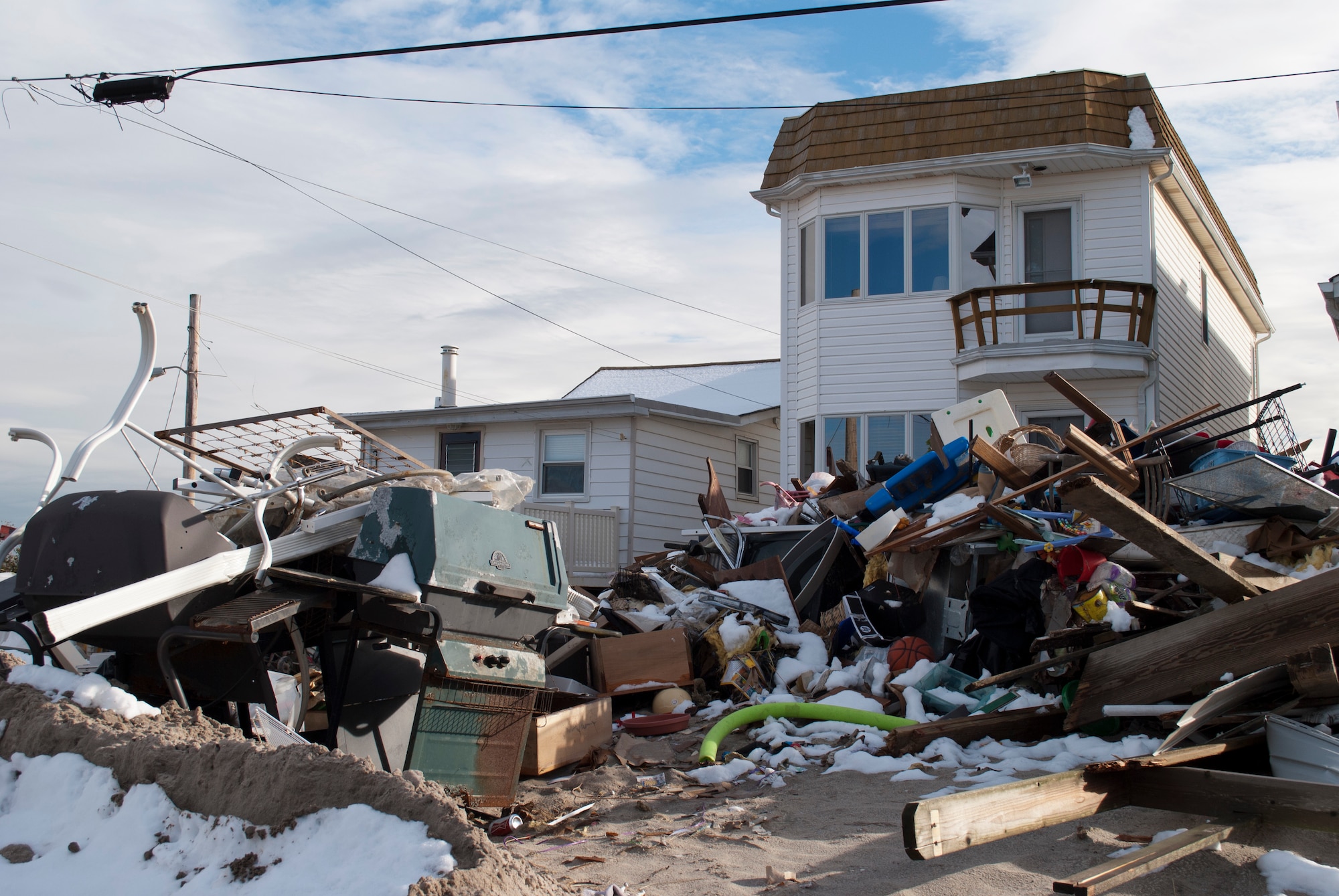 A home destroyed by Hurricane Sandy is covered with debris at Breezy Point, Queens, N.Y., Nov. 8, 2012.  (U.S. Army photo by Sgt. William Adams)