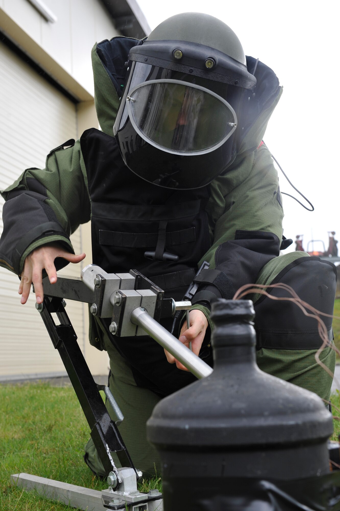 Senior Airman Andrew Nichols, 886th Civil Engineer Squadron explosive ordnance disposal specialist, uses a percussion activated neutralizer on a simulated improvised explosive device while training, May 20, 2013, Ramstein Air Base, Germany. EOD is one of the largest anti-terrorism and force protection missions in U.S. Air Forces in Europe and Air Forces Africa, allowing them to provide home station support to three wings, 26 geographically separated units and two U.S. Army brigades. (U.S. Air Force photo/ Senior Airman Aaron-Forrest Wainwright)