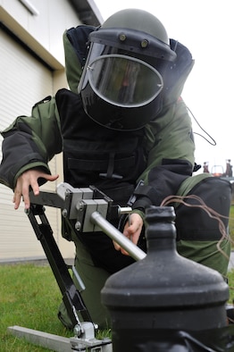 Senior Airman Andrew Nichols, 886th Civil Engineer Squadron explosive ordnance disposal specialist, uses a percussion activated neutralizer on a simulated improvised explosive device while training, May 20, 2013, Ramstein Air Base, Germany. EOD is one of the largest anti-terrorism and force protection missions in U.S. Air Forces in Europe and Air Forces Africa, allowing them to provide home station support to three wings, 26 geographically separated units and two U.S. Army brigades. (U.S. Air Force photo/ Senior Airman Aaron-Forrest Wainwright)