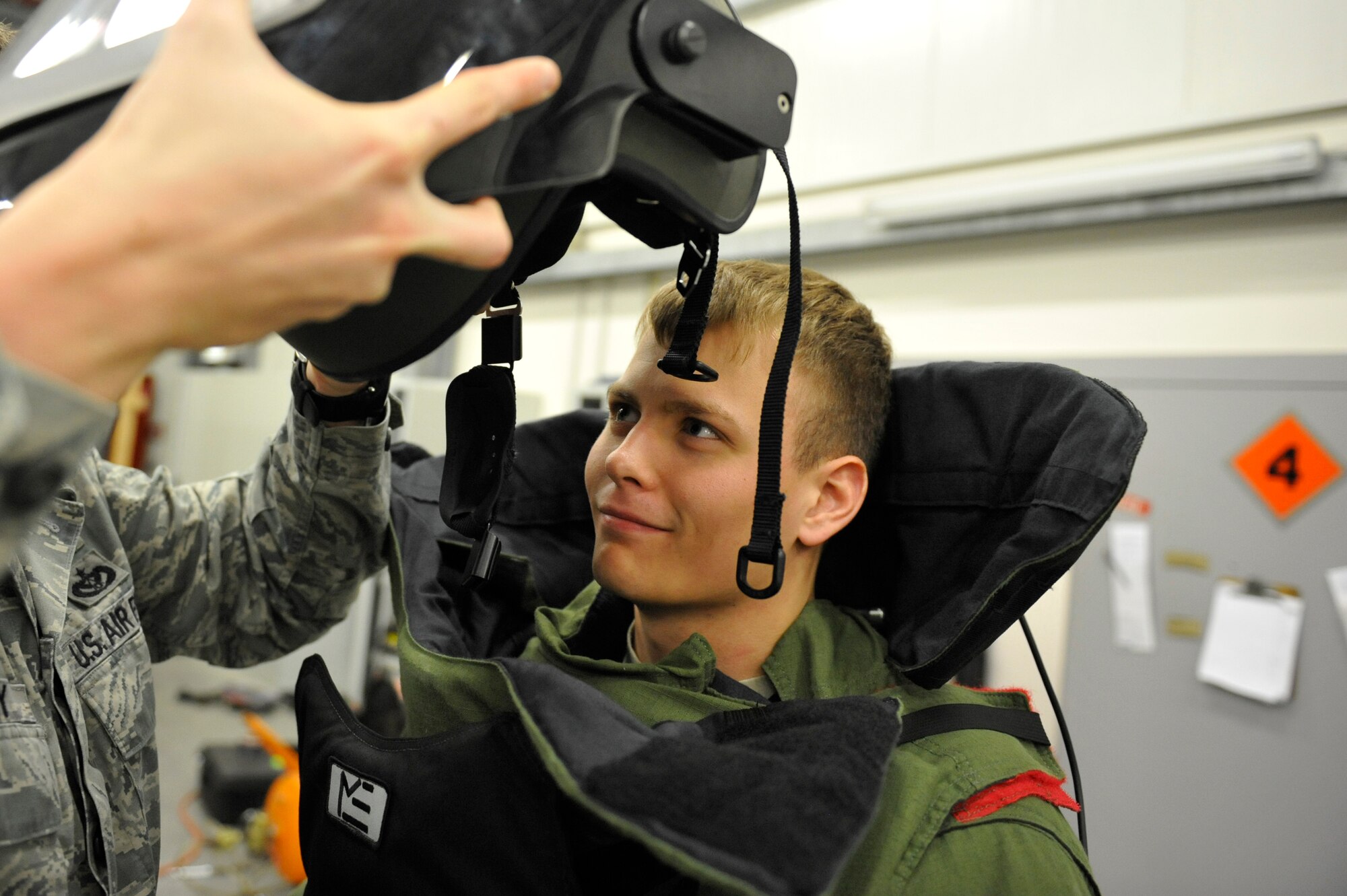 Senior Airman Andrew Nichols, 886th Civil Engineer Squadron explosive ordnance disposal specialist, dons a bomb disposal suit for training, May 20, 2013, Ramstein Air Base, Germany. EOD is one of the largest anti-terrorism and force protection missions in U.S. Air Forces in Europe and Air Forces Africa, allowing them to provide home station support to three wings, 26 geographically separated units and two U.S. Army brigades. (U.S. Air Force photo/ Senior Airman Aaron-Forrest Wainwright)