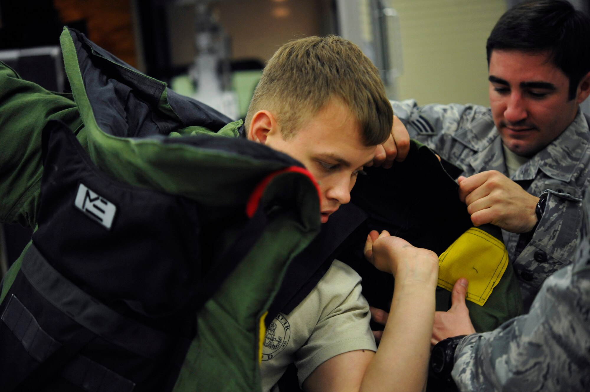 Senior Airman Andrew Nichols, 886th Civil Engineer Squadron explosive ordnance disposal specialist, dons a bomb disposal suit while training, May 20, 2013, Ramstein Air Base, Germany. EOD is one of the largest anti-terrorism and force protection missions in U.S. Air Forces in Europe and Air Forces Africa, allowing them to provide home station support to three wings, 26 geographically separated units and two U.S. Army brigades. (U.S. Air Force photo/ Senior Airman Aaron-Forrest Wainwright)
