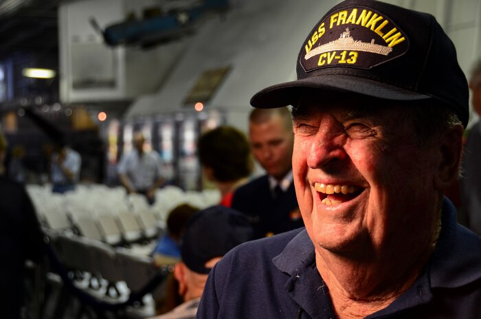 Samuel Rhodes Jr., a World War II veteran, shares a laugh during an interview May 17, 2013, aboard the USS Yorktown (CV 10) at Patriots Point Naval and Maritime Museum. Rhodes, along with approximately 20 remaining crewmembers of the USS Franklin (CV 13) and their family members, gathered for a final reunion. A memorial service in Yorktown’s Hangar Bay II took place near the Franklin exhibit and honored the more than 800 men who were killed in action March 19, 1945, as well as the crewmembers who have since passed. (U.S. Air Force photo/Staff Sgt. Anthony Hyatt)