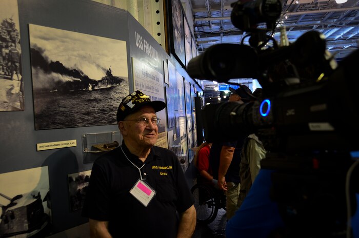 Harold Rausch, who served on the USS Franklin (CV 13), answers questions during an interview May 17, 2013, aboard the USS Yorktown (CV 10) at Patriots Point Naval and Maritime Museum, Mount Pleasant, S.C. More than 20 of the remaining crewmembers of the Franklin gathered for a final reunion. In honor of the historic event, Patriots Point hosted a series of events and educational programs throughout the day to allow the public an opportunity to speak with and hear from the veterans. (U.S. Air Force photo/Staff Sgt. Anthony Hyatt)