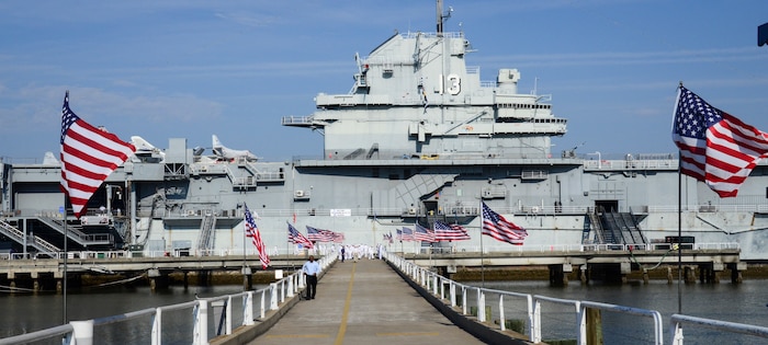 The number 13 is displayed on the USS Yorktown’s (CV-10) island in honor of the USS Franklin (CV-13), as the surviving crewmembers gather for their final reunion May 17, 2013, at Patriots Point Naval and Maritime Museum, Mount Pleasant, S.C. The Franklin participated in Pacific Theater operations during World War II and was in service from 1944 to 1945. The ship is best known for the March 19, 1945 attack, when two Japanese bombs struck the ship. The Franklin earned the designation as the most heavily damaged U.S. aircraft carrier to survive World War II and the ship and crew remain the most decorated in U.S. Navy history – earning two Medals of Honor, 19 Navy Crosses, 22 Silver Stars and 1,100 Purple Hearts. (U.S. Air Force photo/Staff Sgt. Anthony Hyatt)