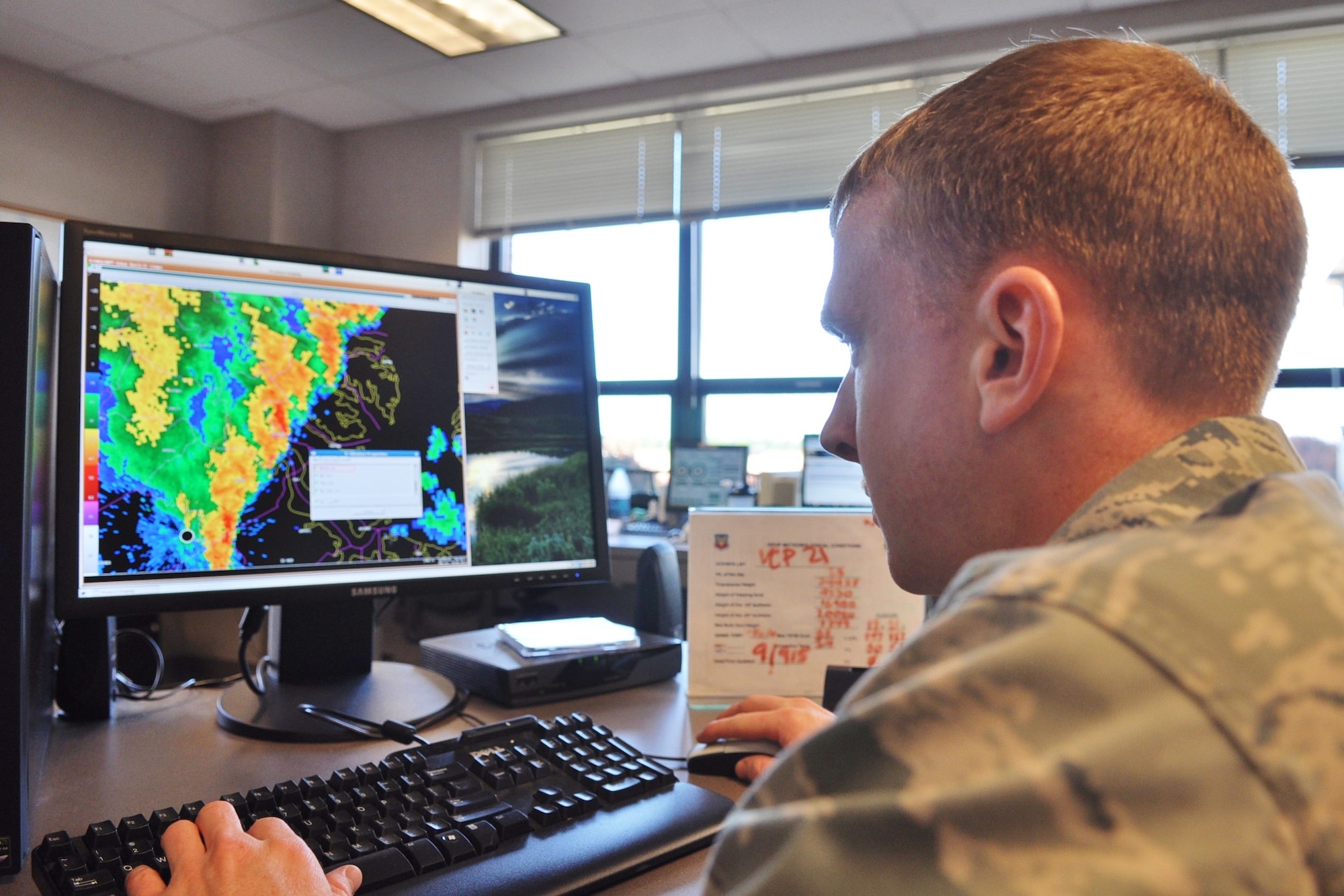 U.S. Air Force Staff Sgt. Daniel McGonigle, 1st Operations Support Squadron weather flight forecaster, studies a radar model at the flight’s operations center at Langley Air Force Base, Va., May 14, 2013. The weather flight constantly monitors tropical weather systems that could potentially impact the area, giving installation leadership timely situational awareness to implement flood and wind damage mitigation efforts. Tracking tropical weather is especially important at Langley, which is prone to flooding due to its low elevation and position amongst tidal marshes. (U.S. Air Force photo by Senior Airman Jason J. Brown/Released)