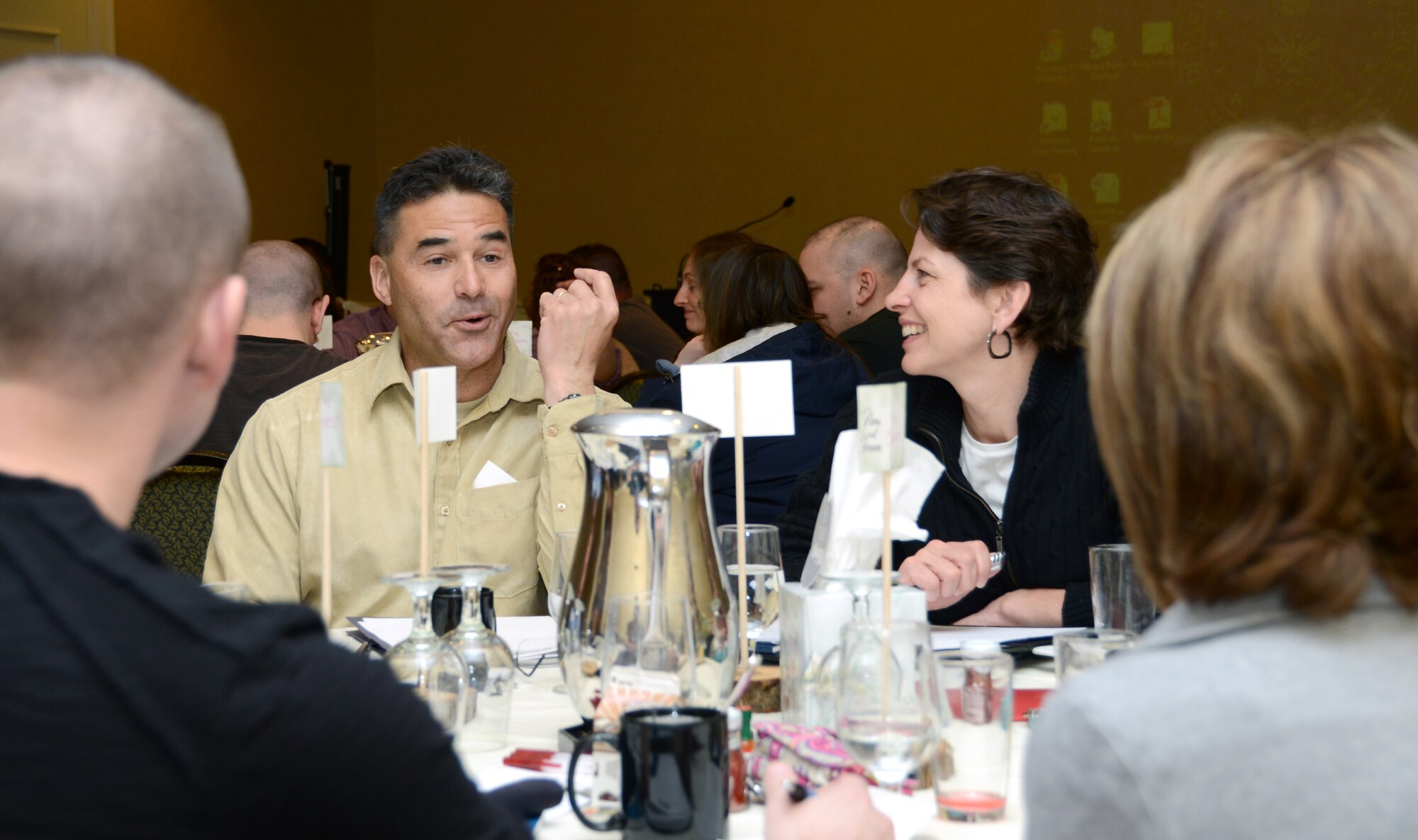 Tech Sgt. Jeffrey Cloutier of the 103rd Civil Engineer Squadron (left center) and his wife, Beth Cloutier, participate in a group discussion at the Strong Bonds weekend hosted by the 103rd Airlift Wing Chaplain’s office at the Mystic Marriott Hotel and Spa located in Groton, Conn., April 12, 2013. The event was aimed at couples who wanted to strengthen their marriages. (U.S. Air National Guard photo by Senior Airman Jennifer Pierce/Released)