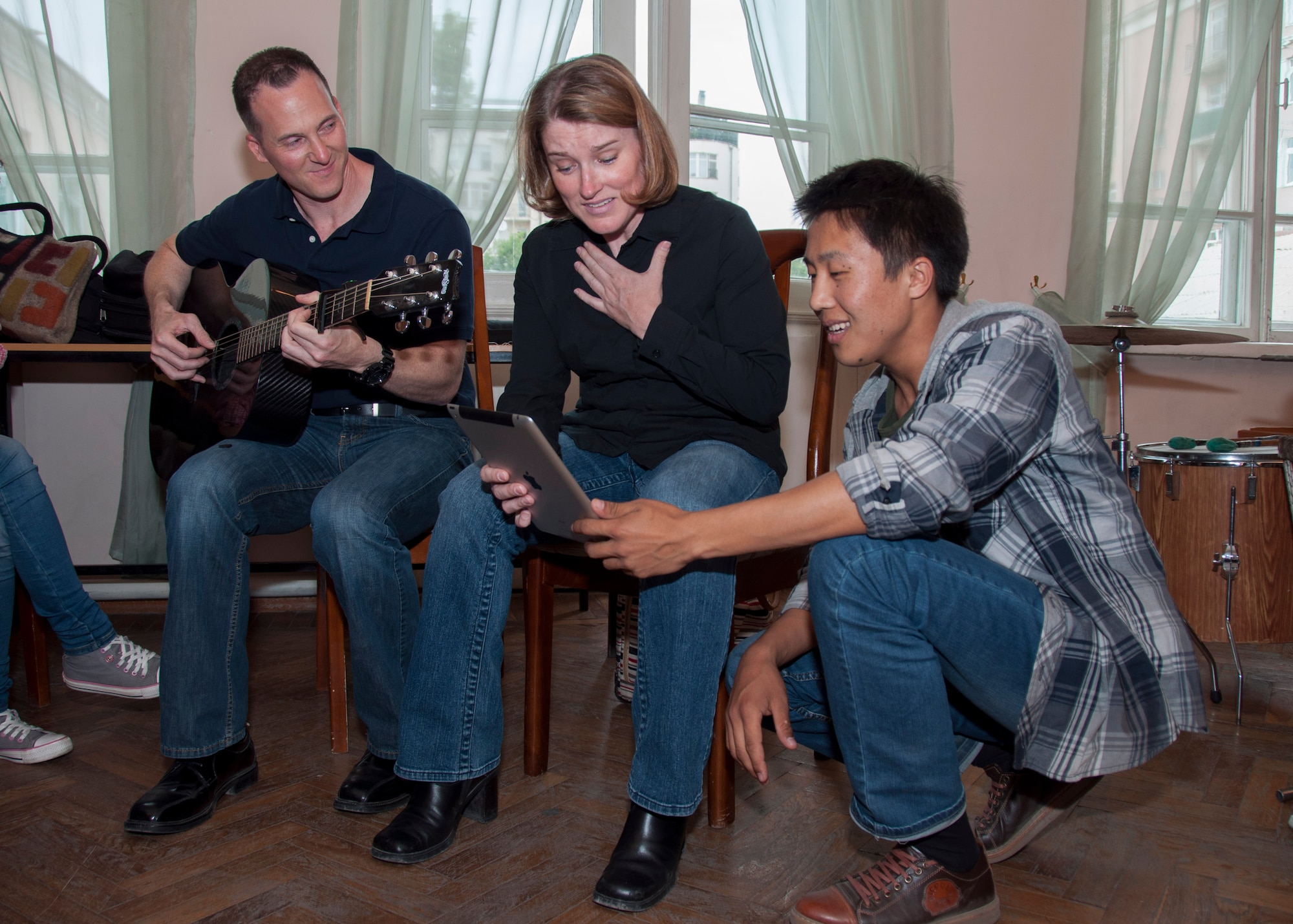 Senior Master Sgt. Matt Ascione and Tech. Sgt. Paige Martin, members of the U.S. Air Forces Central Command band, perform with a member of the Ordo Sakhna Folk Ensemble May 11, 2013, in Bishkek, Kyrgyzstan. The trio sang the Beatles' "Let It Be." (U.S. Air Force photo/Tech. Sgt. Rachel Martinez)