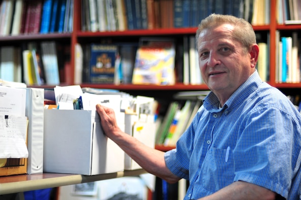 John Okonski, 51st Fighter Wing historian, works to preserve wing history at Osan Air Base, Republic of Korea, May 15, 2013. Accurate and timely historical reporting provides decision-makers with information they can use to improve the combat capability of the United States Air Force and the Department of Defense. (U.S. Air Force photo/Senior Airman Alexis Siekert)