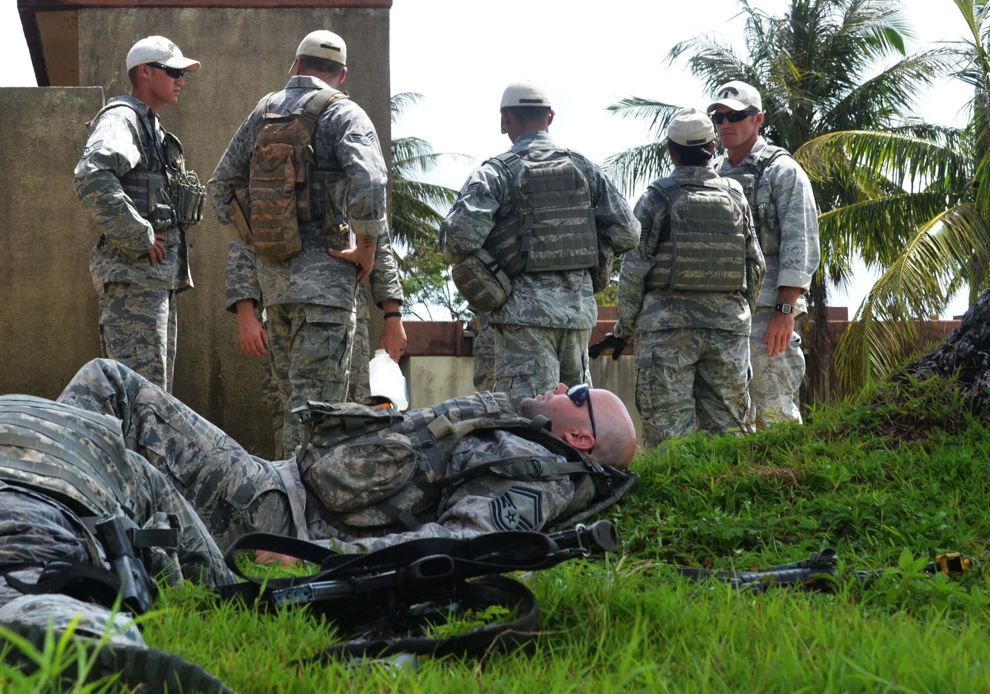 Members from the 736th Security Forces Squadron Commando Warrior Flight discuss tactics used during an urban warfare scenario at Andersen South, Guam, May 17, 2013. The Commando Warrior Flight is responsible for training frontline defenders from all bases assigned to the Pacific Air Forces on U.S. Central Command and regional training requirements so they can deploy as well as utilize trained skills at their home stations. (U.S. Air Force photo by Staff Sgt. Benjamin Wiseman/Released)