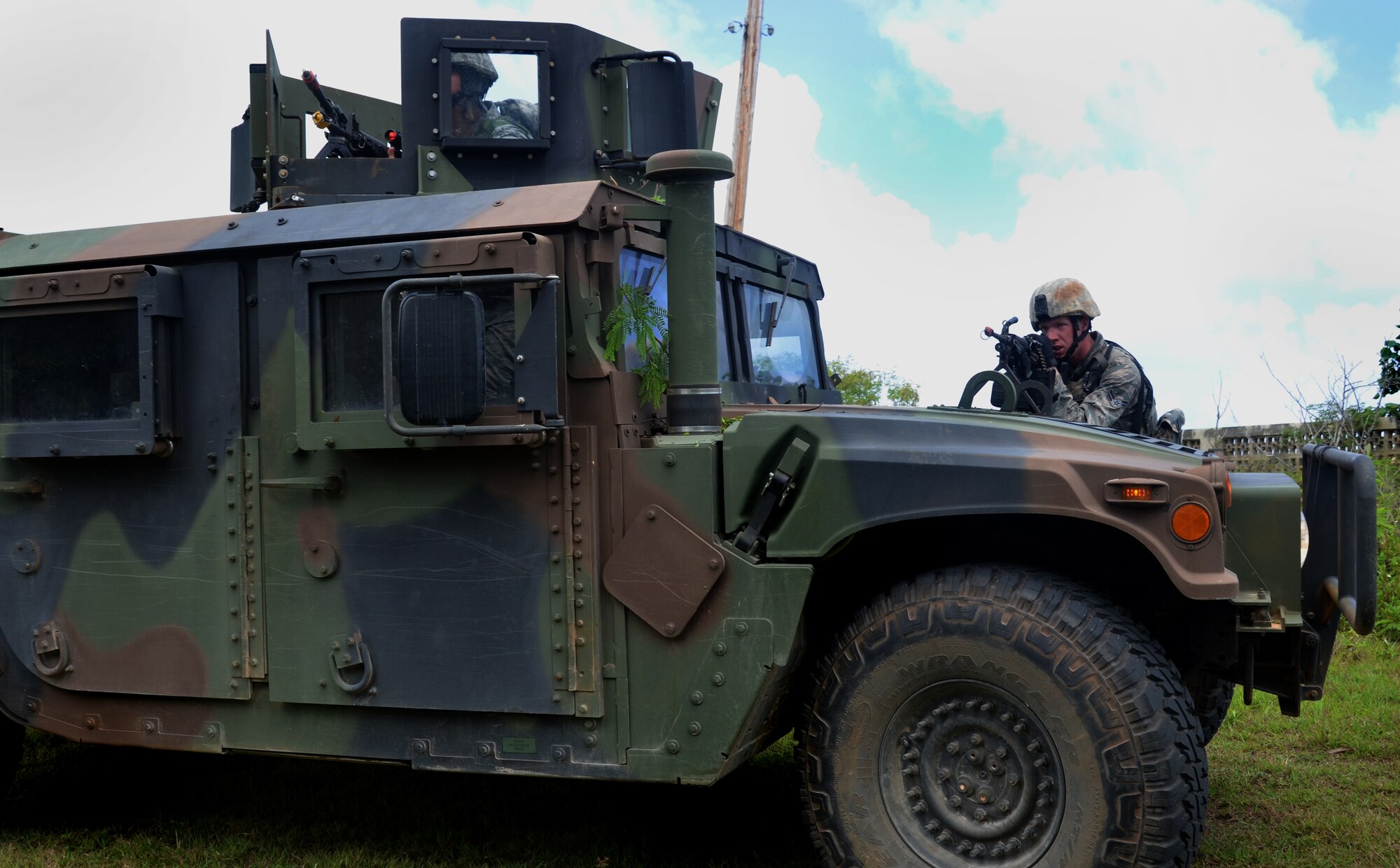 Airman 1st Class Cody Hoxie, 168th Security Forces Squadron fire team member from Eielson Air Force Base, Alaska, provides cover fire for his team during an urban warfare scenario at Andersen South, Guam, May 17, 2013. The Pacific Regional Training Center trains frontline defenders from all bases assigned to Pacific Air Forces on U.S. Central Command and regional training requirements so they can deploy as well as utilize trained skills at their home stations. (U.S. Air Force photo by Staff Sgt. Benjamin Wiseman/Released)