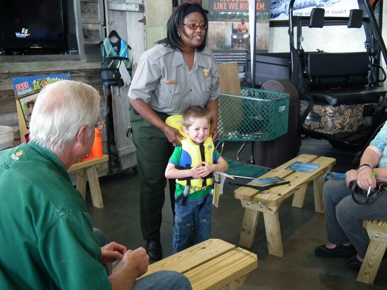 Ranger Love-Jones demostrates the correct fit of a life jacket. 