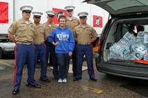 101.3 KDWB radio personality Falen Bonsett accepts a $200 water donation for H2OK from the Marines with Recruiting Substation Roseville May 22. KDWB, Rainbow Foods and 101 Transport Inc. coordinated the event to bring relief to those affected by recent tornadoes in Oklahoma. Donations will be shipped via semi to Moore, Okla., on Thursday. For additional imagery from the event, visit www.facebook.com/rstwincities. 