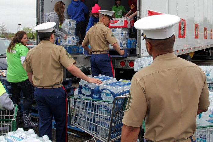 Marines with Recruiting Substation Roseville line up to drop off a $200 water donation for H2OK May 22. Radio station 101.3 KDWB, Rainbow Foods and 101 Transport Inc. coordinated the event for Oklahoma tornado relief. Donations will be shipped via semi to Moore, Okla., on Thursday. For additional imagery from the event, visit www.facebook.com/rstwincities.