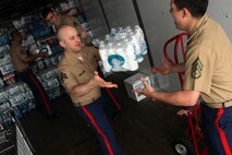 Marines with Recruiting Substation Roseville help unload a pallet of water bottles after dropping off a $200 donation for H2OK May 22. Radio station 101.3 KDWB, Rainbow Foods and 101 Transport Inc. coordinated the event for Oklahoma tornado relief. Donations will be shipped via semi to Moore, Okla., on Thursday. For additional imagery from the event, visit www.facebook.com/rstwincities.