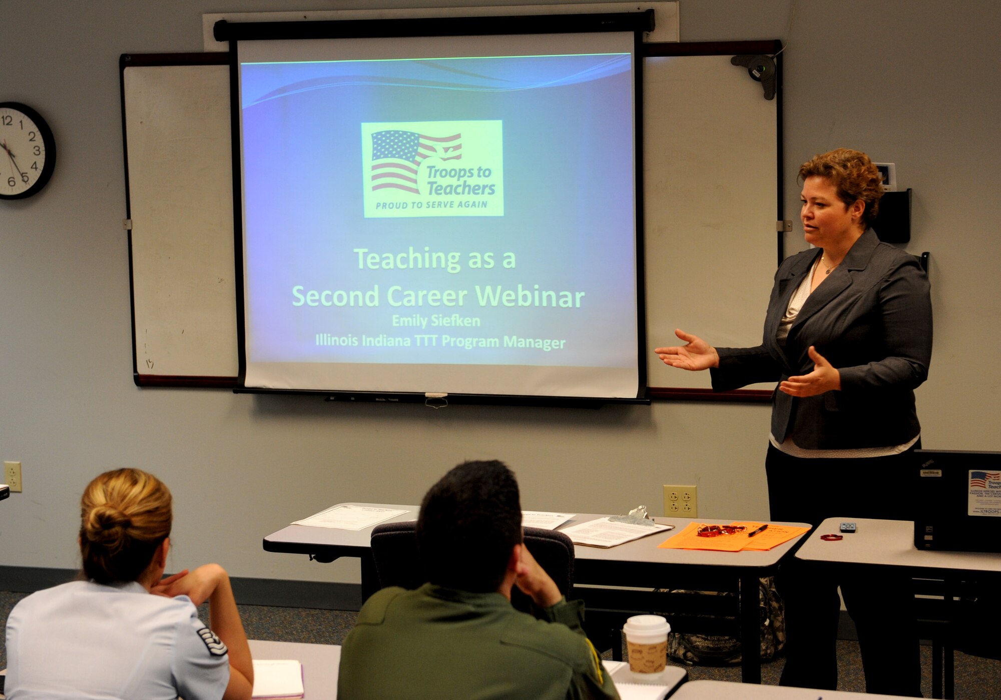 Emily Siefken, Illinois Troops to Teachers program manager, gives a seminar focusing on the TTT program and how it assists military members transistion into becoming teachers May 15 at the Educations Center. TTT provides financial and counseling services to help with taking classes toward a teaching degree or certificate. (U.S. Air Force photo/Staff Sgt. Maria Bowman)