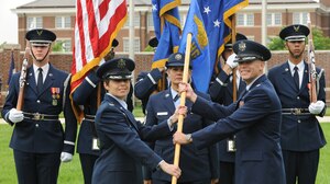 Col. Gina Humble, 11th Operations Group commander, passes the U.S. Air Force Honor Guard guidon to incoming commander, Lt. Col. Timothy Thurston, during an assumption of command at Joint Base Anacostia Bolling’s ceremonial lawn, May 21, 2013. The Assumption of Command ceremony marks a formal passing of responsibility, authority, and accountability of command. (U.S. Air Force photo/Airman 1st Class Aaron Stout)