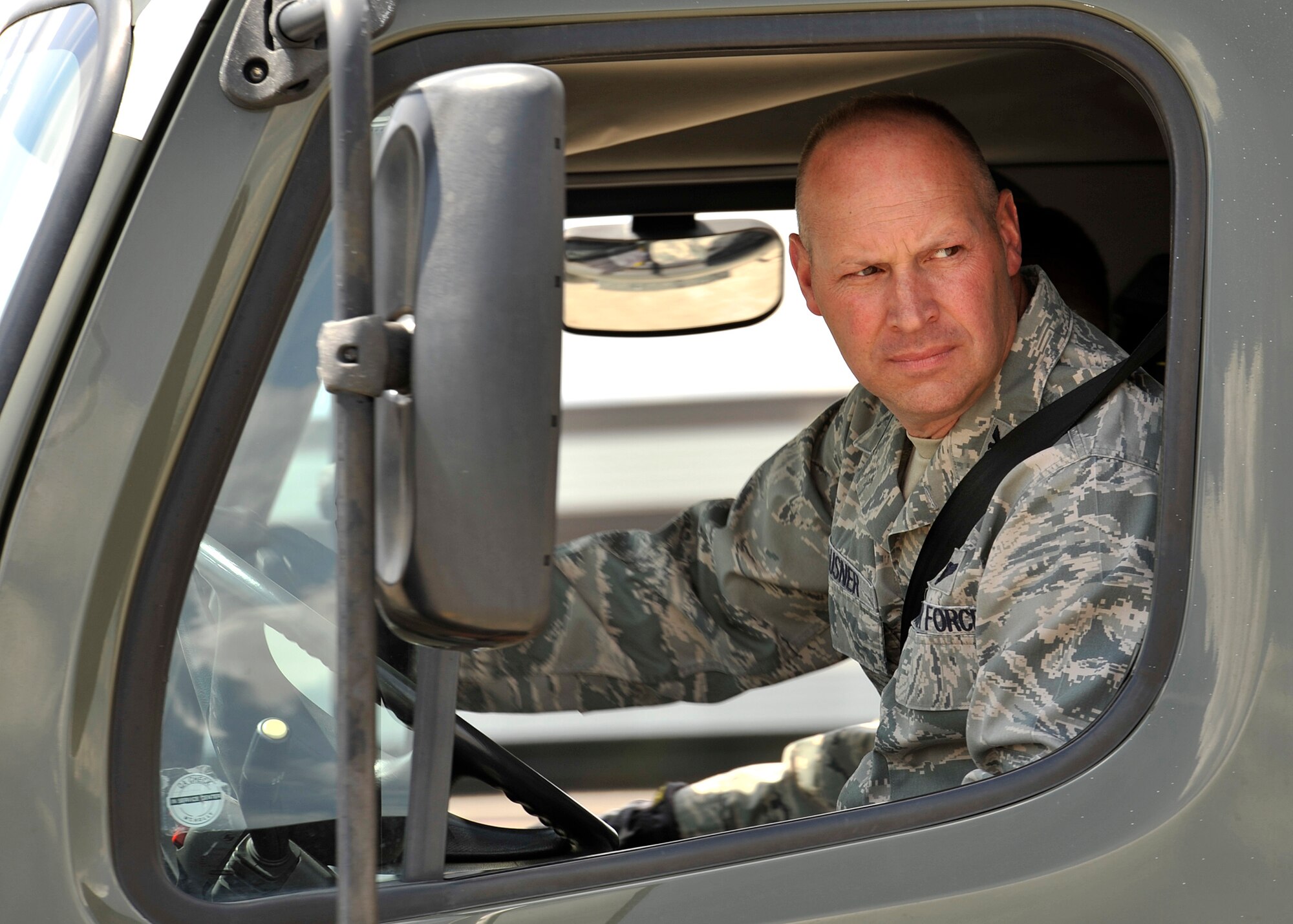 Col. Konrad Klausner, 92nd Mission Support Group commander, drives an R12 fuel truck through an obstacle course at Fairchild Air Force Base, Wash. May 17, 2013. The colonel will periodically participate in the work his Airmen perform to better understand the effort put into the mission. (U.S. Air Force photo by Staff Sgt. Michael Means/Released)