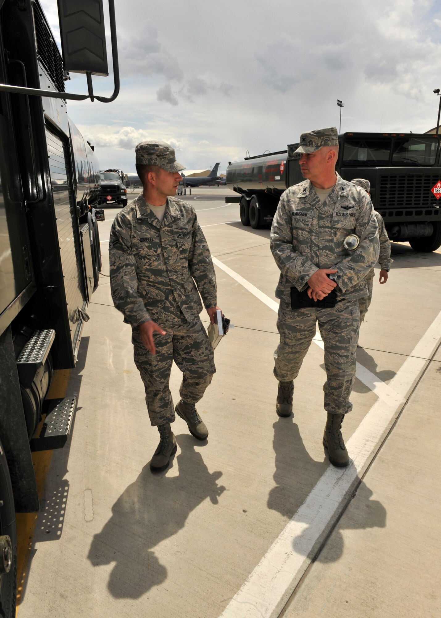 Airman 1st Class Trevor Dinielli, 92nd Logistics Readiness Squadron refueling equipment operator, and Col. Konrad Klausner, 92nd Mission Support Group commander, inspect an R11 fuel truck at Fairchild Air Force Base, Wash. May 17, 2013. The colonel will periodically participate in the work his Airmen perform to better understand the effort put into the mission. (U.S. Air Force photo by Staff Sgt. Michael Means/Released)