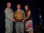 Lt. Gen. Eric Fiel, commander of Air Force Special Operations Command, presents Lt. Col. Nathan Green with the Sijan award at the King Auditorium on Hurlburt Field, Fla., May 22, 2013. The Lance P. Sijan Award, first awarded in 1981, was established in honor of the first U.S. Air Force Academy graduate to receive the Medal of Honor. (U.S. Air Force photo by Senior Airman Krystal M. Garrett)