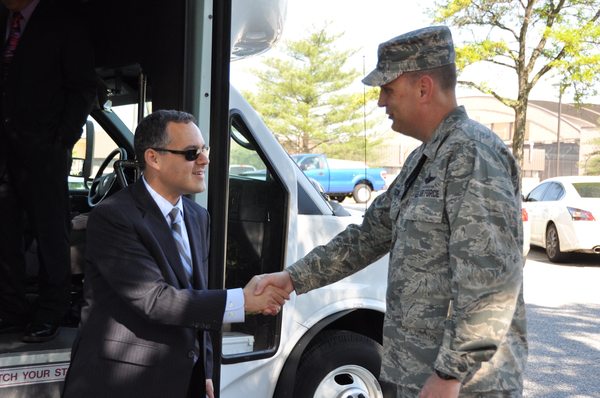 Mr. Daniel Ginsberg, Assistant Secretary of the Air Force for Manpower and Reserve Affairs, Washington, D.C., shakes the hand of Air Force Col. William Mason, commander of the 459th Air Refueling Wing, during a visit to the wing at Joint Base Andrews, Md., May 17, 2013. Ginsberg visited the wing to interact with the Airmen and answer questions regarding manpower issues. (U.S. Air Force photo/ Staff Sgt. Katie Spencer)
