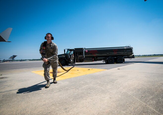 Airman 1st Class Grant Kelly, pulls a hose from an R-11 Fuel Truck so Jet fuel can be pumped into a C-17 Globemaster III May 9, 103, at Joint Base Charleston, S.C. The R-11 Fuel Truck holds up to 6,000 gallons of Jet A fuel at a time. (U.S. Air Force photo/ Senior Airman Dennis Sloan)