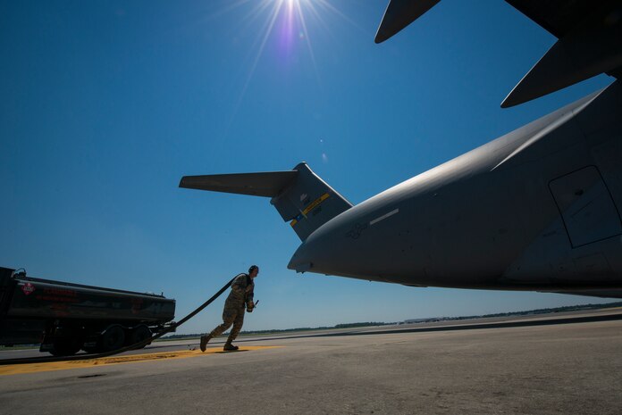 Airman 1st Class Grant Kelly, pulls a hose from an R-11 Fuel Truck so Jet A fuel can be pumped into a C-17 Globemaster III May 9, 103, at Joint Base Charleston, S.C. The R-11 Fuel Truck holds up to 6,000 gallons of Jet fuel at a time. (U.S. Air Force photo/ Senior Airman Dennis Sloan)
