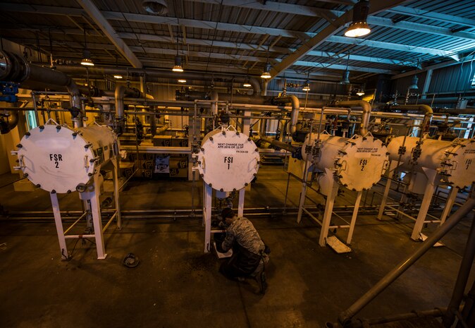 Senior Airman Dameion Johnson, 628th Logistics Readiness Squadron Fuels specialist, drains water from a pump separator in the pump house May 9, 2013, at Joint Base Charleston – Air Base, S.C. The pump house stores fuel that is eventually sent to the flightline. (U.S. Air Force photo/ Senior Airman Dennis Sloan)