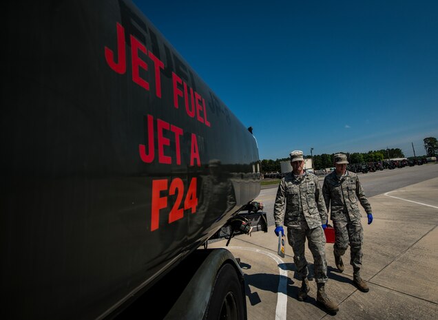 Senior Airman Mark Miller and Airman 1st Class Chaz Wise, 628th Logistics Readiness Squadron Fuels Laboratory technicians, walk out to an R-11 Fuel Truck to perform a visual test on Jet Fuel May 9, 2013, at Joint Base Charleston – Air Base, S.C. The test will let the Airman know if there is water or sediments in the fuel. (U.S. Air Force photo/ Senior Airman Dennis Sloan)