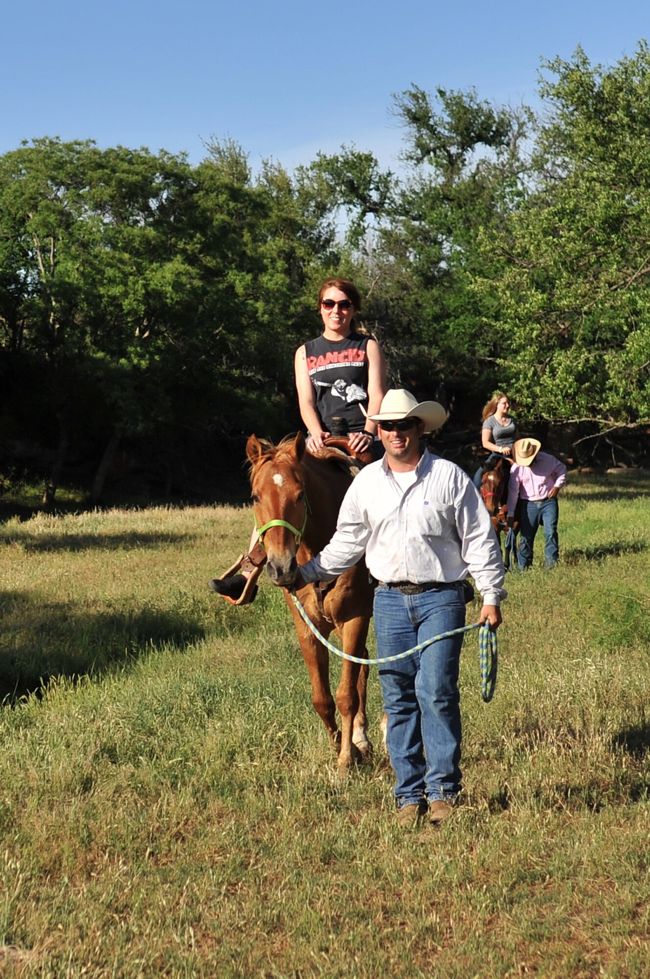 NINE-MILE SPRING, Okla. – Altus Air Force Base members ride horses during the Committee of 100 welcoming dinner, 20 May. The Committee of 100 has hosted this event for more than 25 years to help base newcomers and Airmen returning from deployment connect and create lasting friendships with local community members. (U.S. Air Force photo by Senior Airman Dillon Davis/Released)
