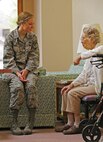 MINOT, N.D. -- Airman 1st Class Kelsey Wade, 791st Missile Security Forces Squadron response force member, spends time with a resident of Minot Triinity Homes, May 18. She volunteered to help out at an Ice Cream Social hosted at the facility by the squadron's organization: Friend of Veterans. (U.S. Air Force photo/Senior Airman Jose L. Hernandez)