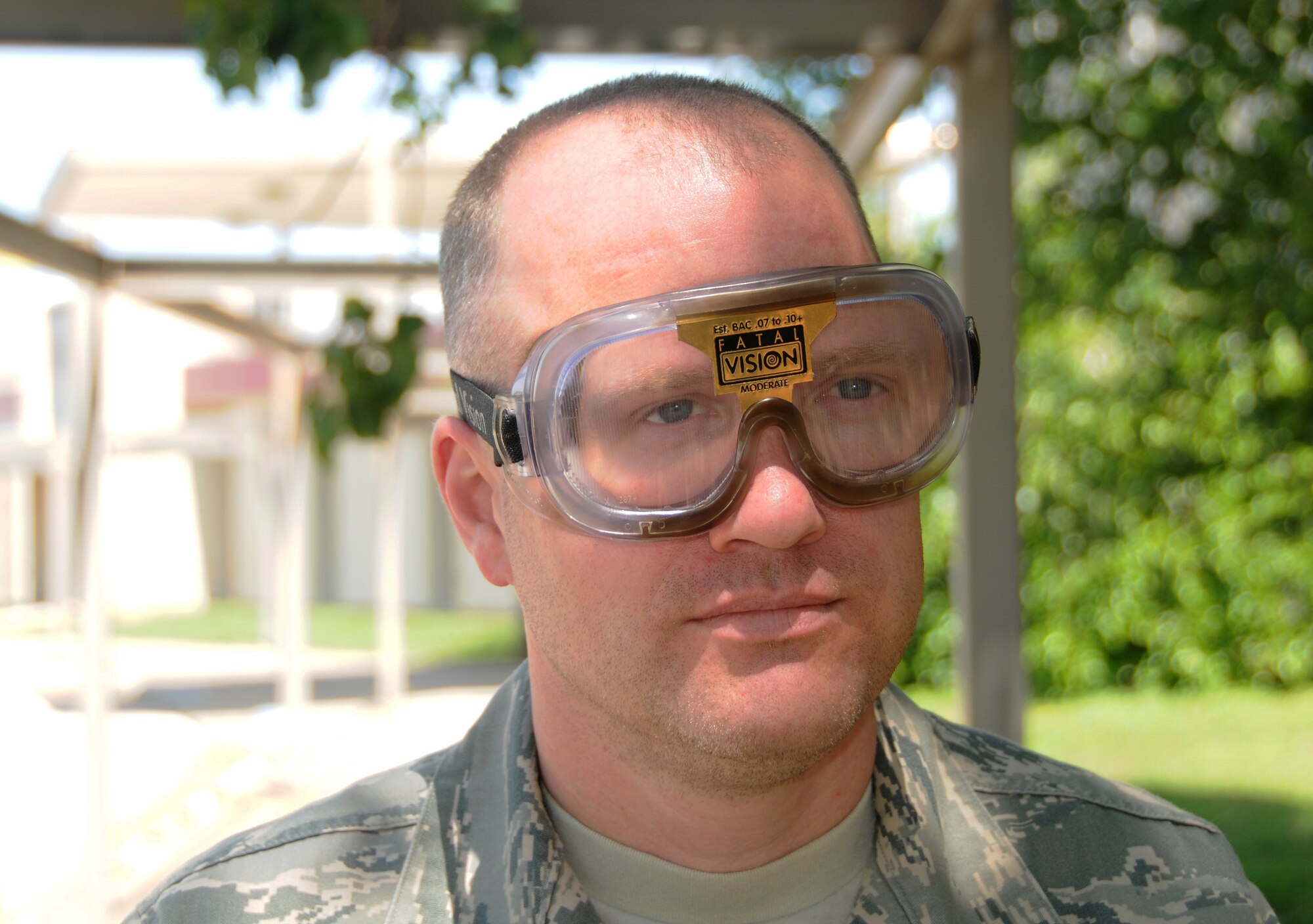 Technical Sgt. John Vincent, 188th Fighter Wing Safety Office, demonstrates the vision distorting effects of the drunk driving simulator goggles during the wing's Alcohol Abuse Awareness Day, May 12, 2013. More than 90 Airmen took part in the event, which featured the simulator, guest speakers and a video presentation. (U. S. Air National Guard photo by Senior Airman John Hillier/188thFighter Wing Public Affairs)