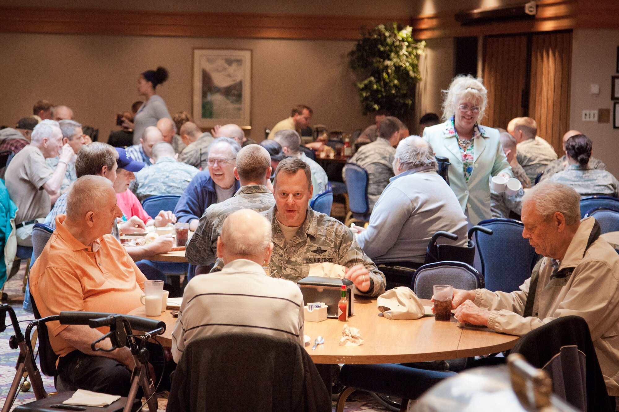 The 934th Airlift Wing hosts its annual Take a Vet to Lunch day at the Services Club at the Minneapolis-St. Paul Air Reserve Station.  Residents of the Minneapolis and Hastings Veterans Homes had lunch with service members and took a tour of a C-130.  (U.S. Air Force photo/Shannon McKay)