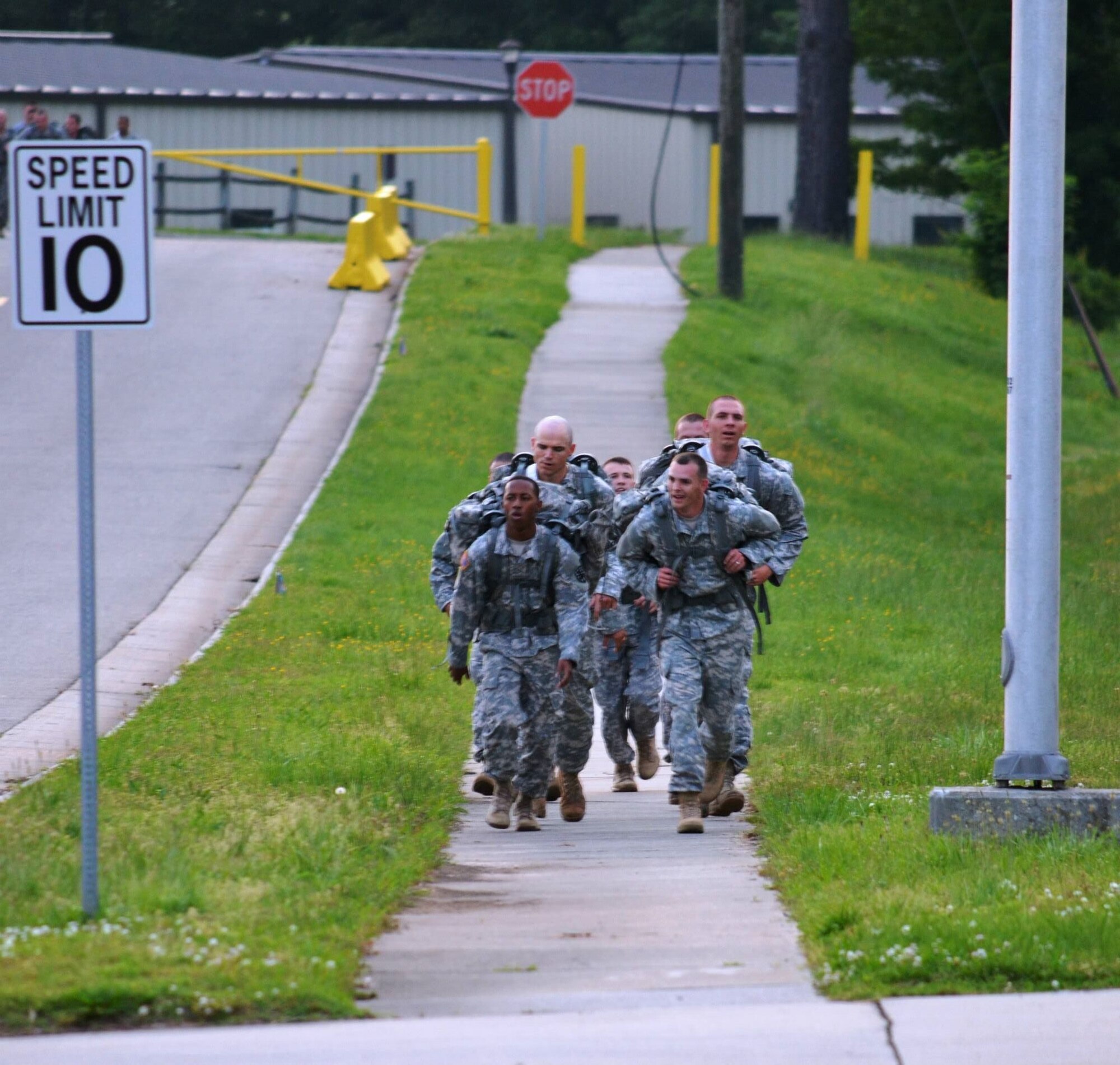 Soldiers from the 10th Transportation Battalion, 7th Sustainment Brigade arrive at 3rd Port following the first portion of a seven-mile ruck march during a pre-dawn squad fitness competition at Fort Eustis, Va., May 17, 2013. The 97th Trans. Co. earned the coveted “Waterborne Belt,” granted to the winning company in the multi-event competition. (U.S. Army photo by Sgt. 1st Class Brian G. Rhodes/Released)