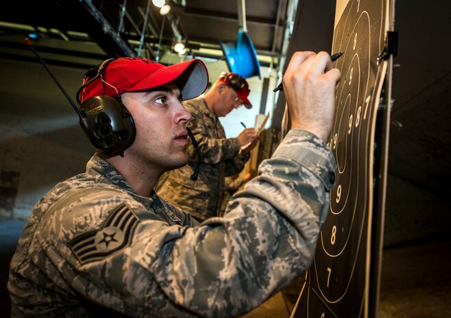 Staff Sgt. Eric Lawrence, 628th Security Forces Squadron Combat Arms Training and Maintenance instructor, tallies the number of hits during the Security Forces Shooting Competition May 15, 2013, at Joint Base Charleston – Air Base, S.C. Service members, civilians, dependents and retirees from the base and local community competed in teams of four against one another in honor of National Police Week. (U.S. Air Force photo/ Senior Airman Dennis Sloan)