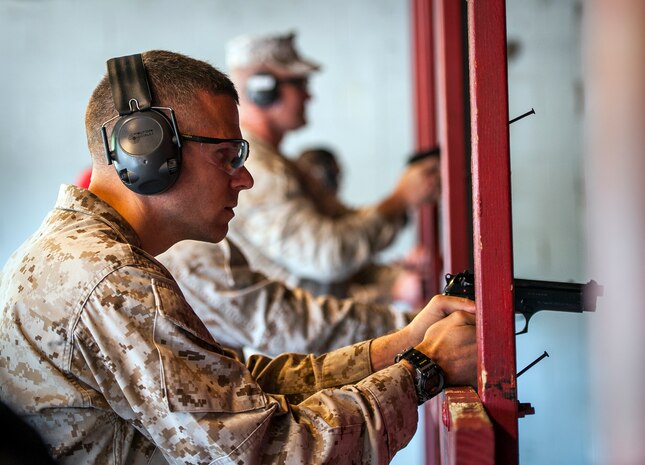 A team of four Marines from Naval Consolidated Brig Charleston compete in the Security Forces Shooting Competition May 15, 2013, at Joint Base Charleston – Air Base, S.C. Service members, civilians, dependents and retirees from the base and local community competed in teams of four against one another in honor of National Police Week. (U.S. Air Force photo/ Senior Airman Dennis Sloan)