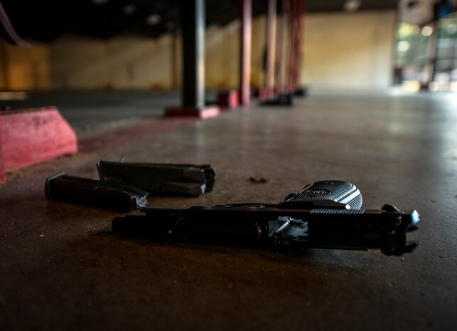 Service members, civilians, dependents and retirees from the base and local community use M-9 pistols during the Security Forces Shooting Competition May 15, 2013, at Joint Base Charleston – Air Base, S.C. In honor of National Police Week, JB Charleston held a Guns and Hoses competition, Military Working Dog demonstration and a Retreat ceremony at the JB Charleston - Air Base flagpole. (U.S. Air Force photo/ Senior Airman Dennis Sloan)