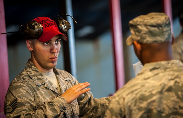 Staff Sgt. Eric Lawrence, 628th Security Forces Squadron Combat Arms Training and Maintenance instructor, explains the Security Forces Shooting Competition rules to service members May 15, 2013, at Joint Base Charleston – Air Base, S.C. In honor of National Police Week, JB Charleston held a Guns and Hoses competition, Military Working Dog demonstration and a Retreat ceremony at the JB Charleston - Air Base flagpole. (U.S. Air Force photo/ Senior Airman Dennis Sloan)