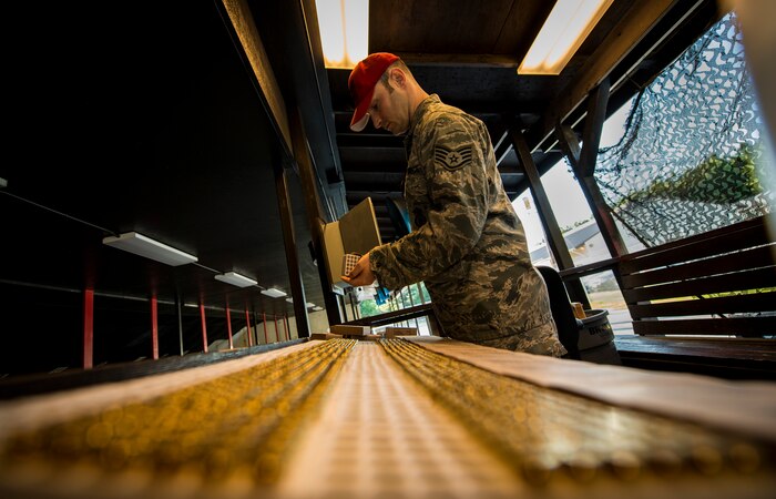 Staff Sgt. Robert Gibson, 628th Security Forces Squadron Combat Arms Training and Maintenance instructor, prepares cases of 9mm rounds to be used in the Security Forces Shooting Competition May 15, 2013, at Joint Base Charleston – Air Base, S.C. Service members, civilians, dependents and retirees from the base and local community competed in teams of four against one another in honor of National Police Week. (U.S. Air Force photo/ Senior Airman Dennis Sloan)