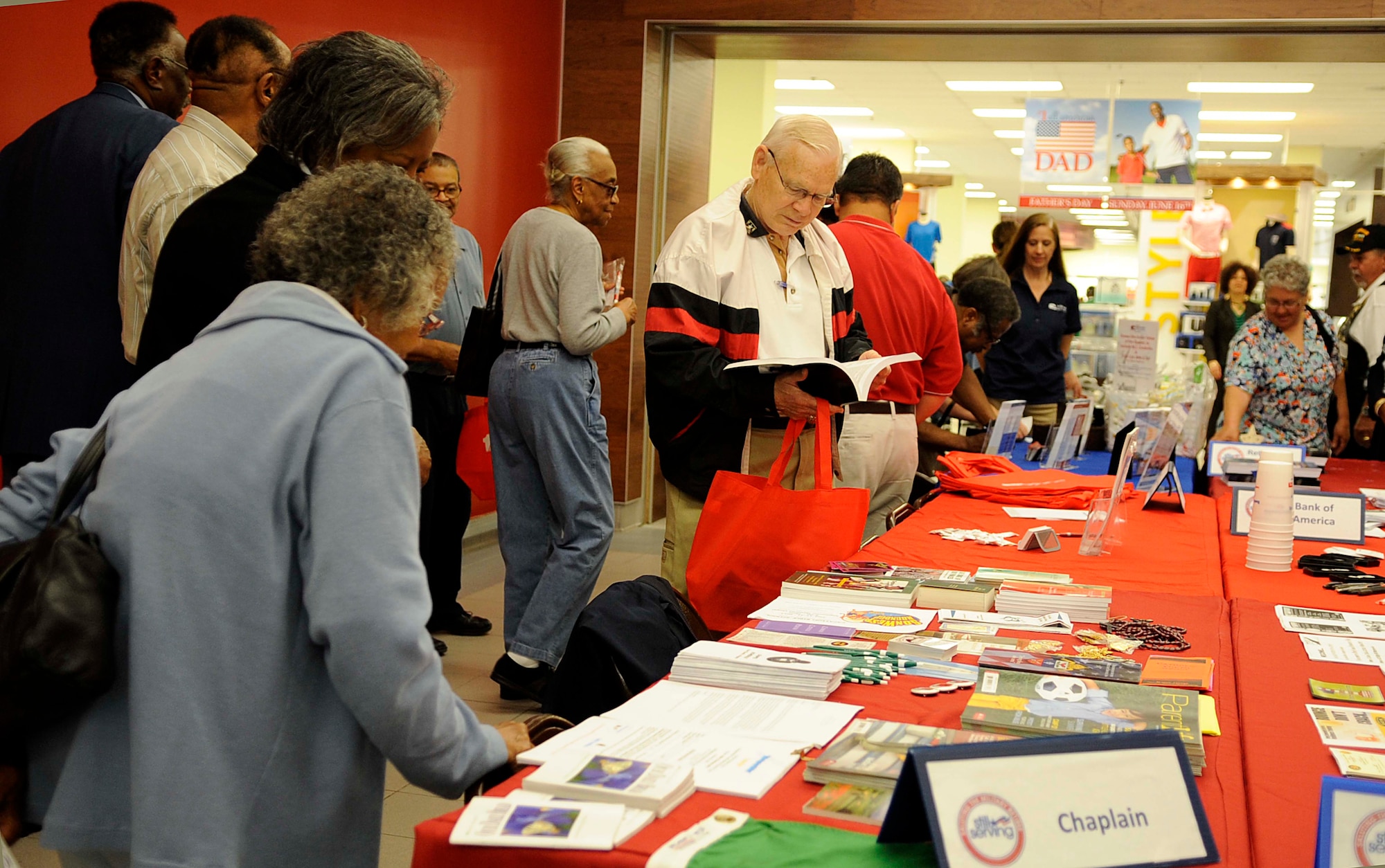 Retirees gather information from different vendors during the annual Retiree Appreciation Day at Fort Eustis, Va., May 18, 2013. Spearheaded by the Fort Eustis Retiree Council, this annual event provides continuity between the retired and active-duty community.  (U.S. Air Force photo by Staff Sgt. Dana Hill/Released)