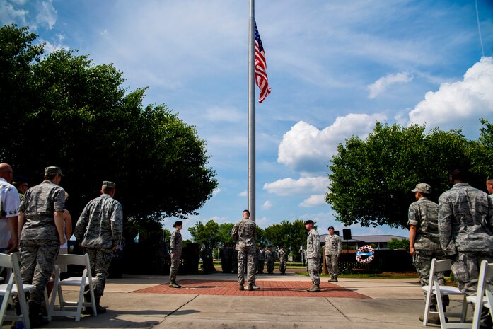 Tech. Sgt. Shaun Horn, 628th Security Forces Squadron flight chief, Staff Sgt. Adam Thompson, 628th SFS Combat Arms Training and Maintenance instructor, Senior Airman Jonathan Breed, 628th SFS armorer, and Airman 1st Class Heather Miller, 628th SFS patrolman, perform flag detail during the Police Week Retreat ceremony May 17, 2013, at Joint Base Charleston - Air Base, S.C. The 628th Security Forces Squadron hosted events including the "Guns and Hoses" fitness challenge, a shooting competition, chili cook-off and a retreat ceremony. National Police Week recognizes the services and sacrifices of U.S. law enforcement personnel.  (U.S. Air Force photo/ Senior Airman George Goslin)