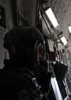 Master Sgt. Michael Folker, 326th Airlift Squadron loadmaster, communicates with aircrew aboard a C-17 Globemaster III during a noncombatant evacuation operation as part of Operation Bunny Flag May 3-5, 2013, Nellis AFB, Nev. The aircrew used a low-level route strategy to face the simulated threats during Operation Bunny Flag. (U.S. Air Force photo/ Senior Airman Erika Brooke) 