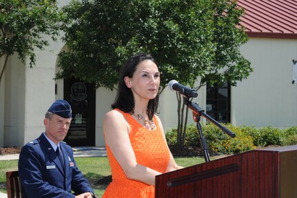 Rhonda Jahns, wife of the late Major Peter "Oly" Jahns, speaks at the dedication of  Jahns Hall, building 39 at Joint Base San Antonio-Randolph, May 17, 2013. Major Jahns, a former T-38 instructor pilot, died in a crash March 19, 2003, during a routine training flight at Randolph. (Air Force photo by Richard McFadden)